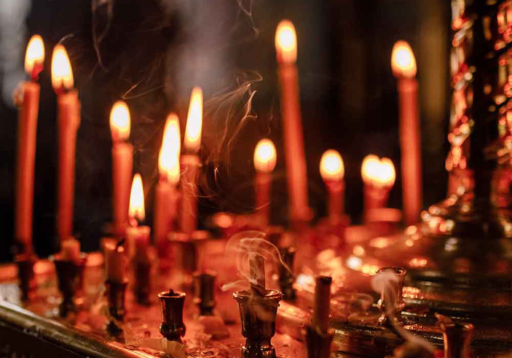 red church candles burning