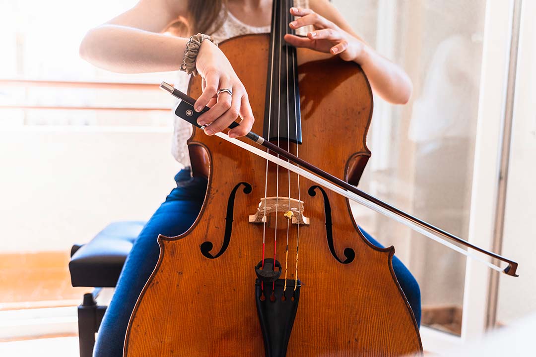 cellist playing their cello