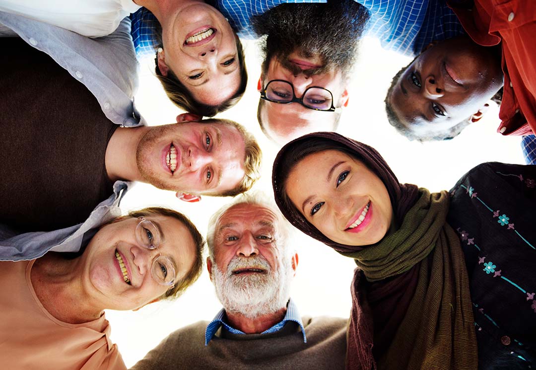 group of people crowded around the camera