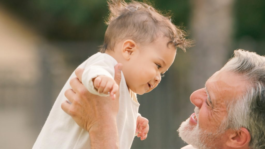 older-man-and-infant So the commandment is a challenge. To love those who betray you. Those who jeer. Those who wield the whips embedded with flint, hammer in the nails, pierce your side.